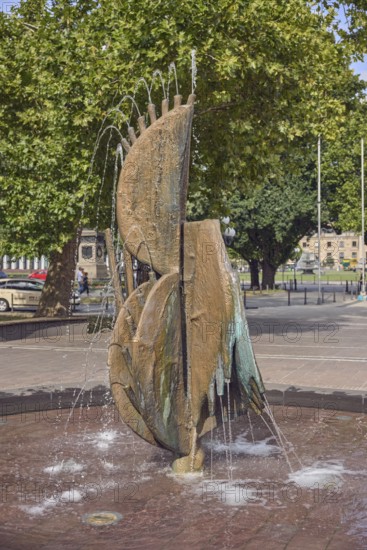 Fountain complex, bronze sculpture, sculptor Ernst Dostal, trees, depth of focus, frozen movement, sunny, Kaiser-Friedrich-Platz, Wiesbaden, state capital, district-free city, Hesse, Germany