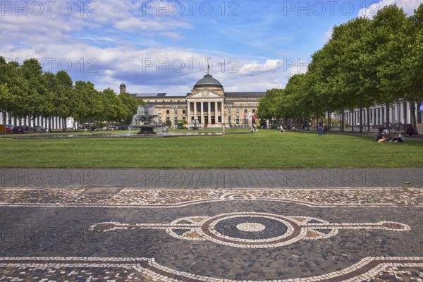 Pavement made of paving stones, mosaic, pattern, spa hotel, gardens, lawn, bowling green, trees, Platanus × acerifolia (Platanus ×hispanica), cascading fountain, blue sky, cumulus clouds, square Kurhausplatz, Wilhelmstraße, Wiesbaden, state capital, independent city, Hesse, Germany