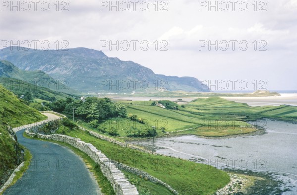 Narrow country road to coastal village of Portnoo, Narin beach, County Donegal, Ireland 1969