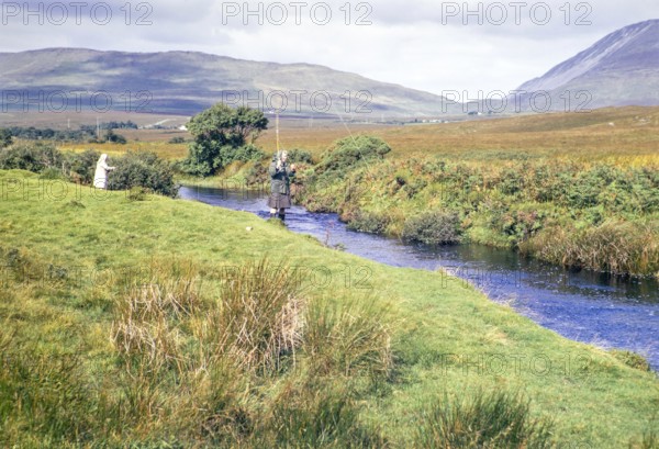 Women fishing in stream County Donegal, Ireland 1971