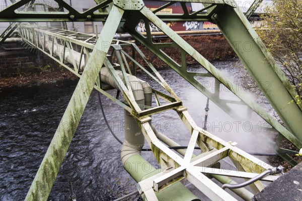 District heating pipeline over the Wupper river, steam escapes, Wuppertal, Germany