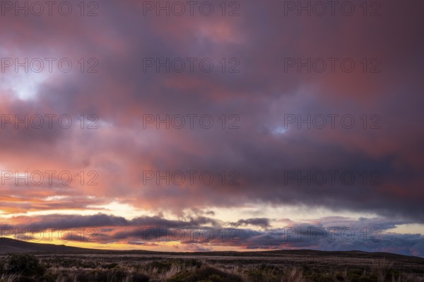 Cloudy sky at sunset, Tama Lake Walk (Tama Lakes Track) . Tongariro National Park, North Island, New Zealand