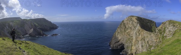 View of blue sea and cliffs with rock gate from Portacloy Loop Cliff Walk, Muingnabo, County Mayo, Ireland