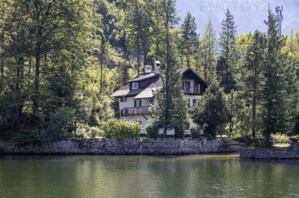A, Hallstatt, A cozy house tucked away on the edge of a quiet lake surrounded by thick forest, Austria