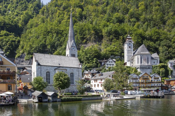 A, Hallstatt, Two churches and traditional houses in a picturesque lakeside village, Austria