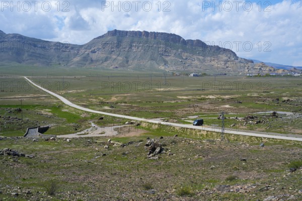 Panoramic view of a rural road winding through a vast mountain landscape, landscape near Demirtepe, Dogubayazit, Dogubayazit, Dogubeyazit, Agri Province, Agri, Eastern Anatolia, Anatolia, Turkey