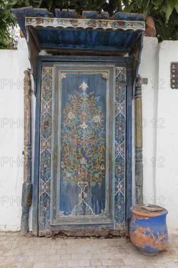 Elaborately decorated blue door with oriental patterns, the oldest door in the Kasbah of Oudaia in Rabat, Morocco