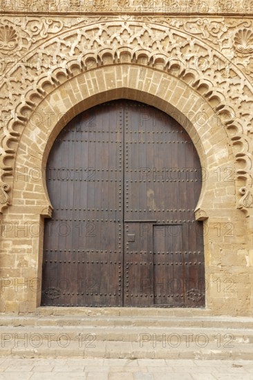 Large gate with finely detailed sandstone engravings