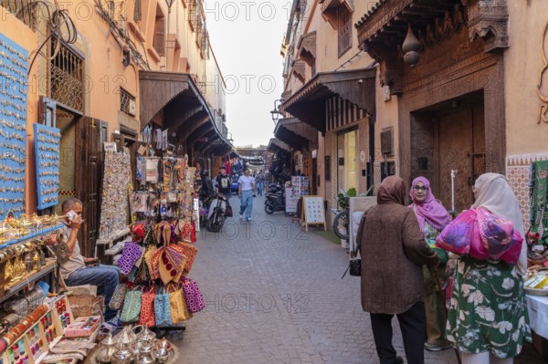 Lively market alleyway with lots of shops and souvenirs in a narrow alley