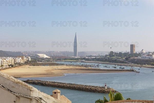 Estuary with beaches and a distinctive skyscraper in the background, Mohammed VI Tower in Rabat in Morocco