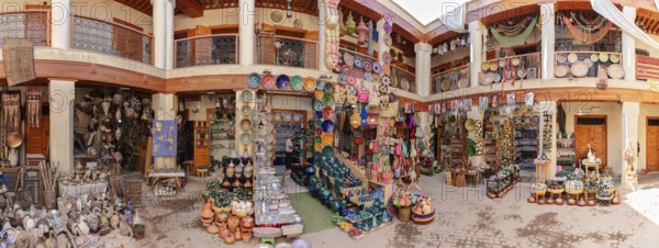 A colorful Moroccan market with pottery and crafts in a traditional setting