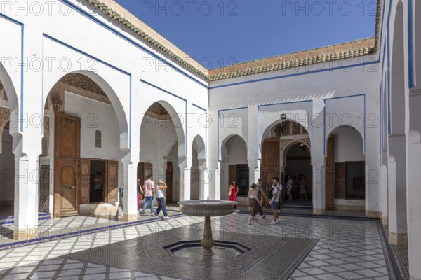 Open courtyard with fountain and arcades surrounded by traditional architecture, Bahia Palace in Marrakech, Morocco