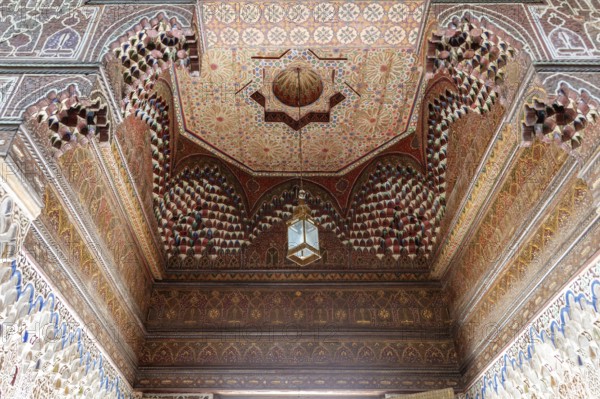 Magnificent, detailed vaulted ceiling full of geometric patterns and wooden elements, Bahia Palace in Marrakech, Morocco