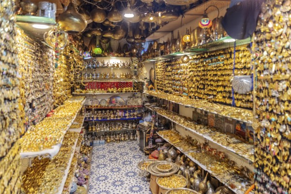 Tight shop full of shiny golden decorations and jewelry