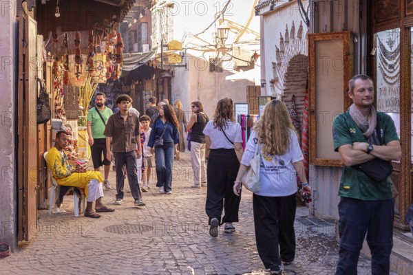 Busy street with people and shops in an oriental town