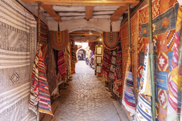 Narrow path with colorful, traditional carpets