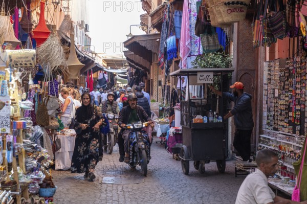 Lively market with street shops and people in traditional surroundings