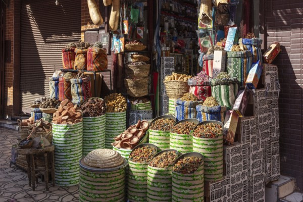 A colorful spice market in Marrakesh with bags and baskets full of fragrant spices and bright substances
