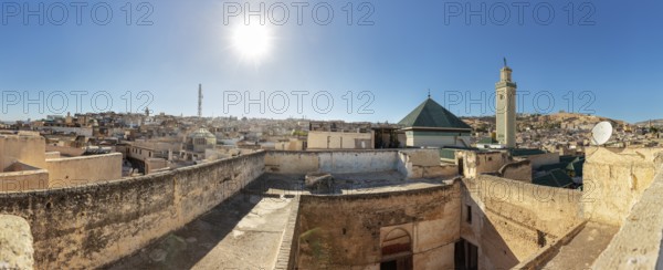 Panoramic view of the old town with minaret in clear skies and strong sunlight
