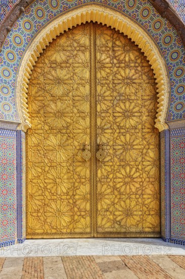 Close-up of an intricately carved and decorated palace door