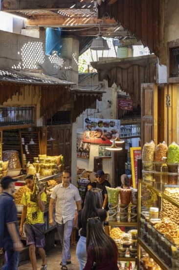 A wide range of spices in a lively bazaar with traditional stalls