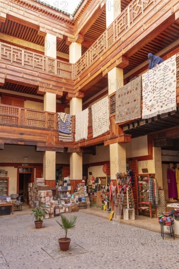 A decorated courtyard with textiles and traditional crafts
