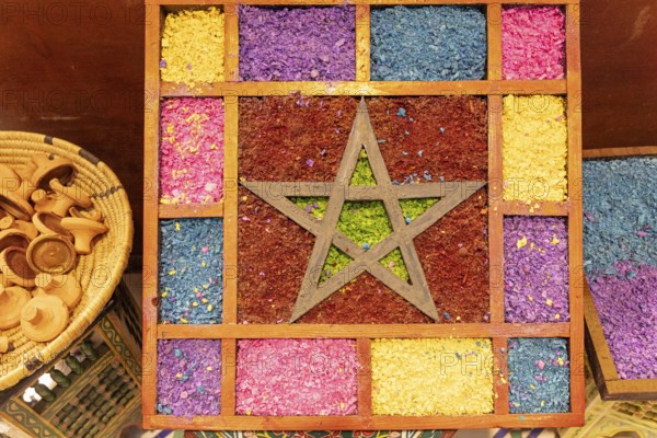 Vivid textile decor with a central star motif surrounded by a patchwork of colorful patterns