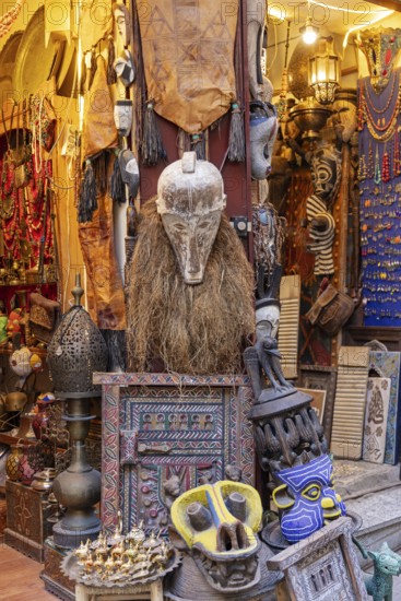 A shop full of colorful masks and tribal crafts with unusual decorations