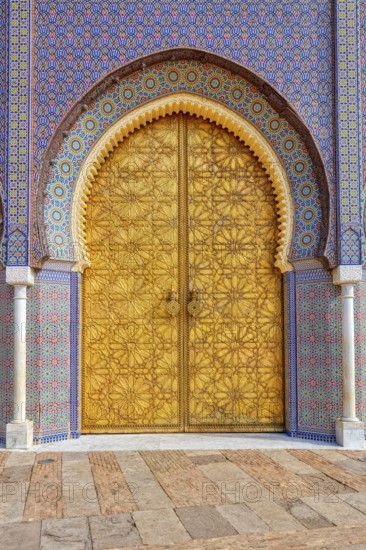 Decorated palace door with colorful mosaic patterns and architectural details