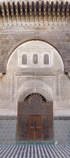 Impressive gate with rich decorations and mosaics in traditional architecture