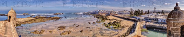 Panoramic view of a wide coastline and the sea with historic architecture