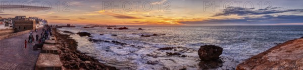 Panorama of the coast at sunset with vivid colors and rocks