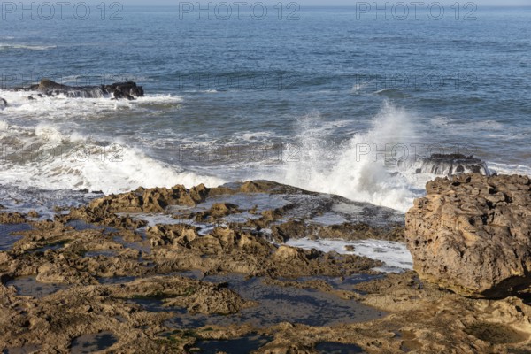 Powerful waves hit rocky coast when visibility is clear