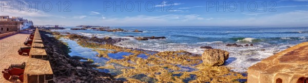 Panorama of a rocky coast with clear blue sky
