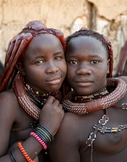 Group of Himba people, Himba woman, traditional Himba village, Kaokoveld, Kunene, Namibia