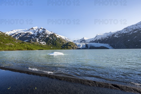 Snowy mountains and glaciers Portage Glacier on Portage Lake glacial lake, Chugach National Forest, Alaska, USA
