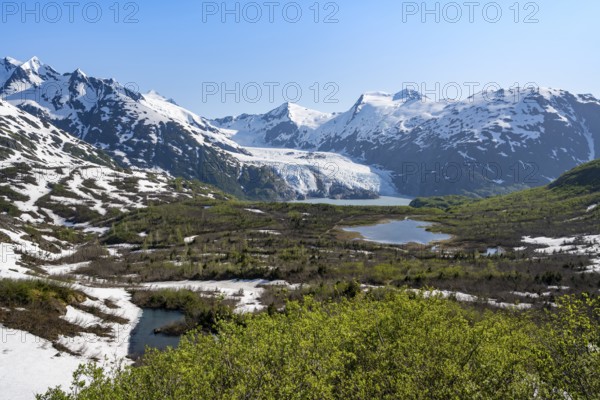 View from Portage Pass of Divide Lake, snowy mountain peaks and glaciers Portage Glacier, Portage Pass Trail, near Whittier, Alaska, USA