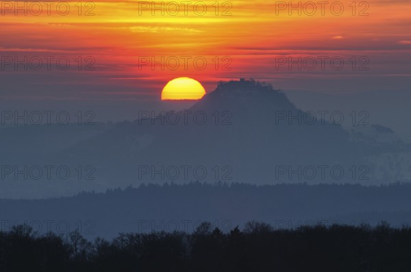 The distinctive silhouette of the Hohentwiel Hegau volcano at sunset, Konstanz district, Baden-Württemberg, Germany