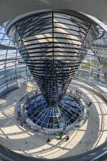 Interior view with fisheye effect of the glass dome of the Reichstag building with the cone-shaped light deflection element, which is equipped with 360 individual mirrors. These channel natural daylight into the plenary hall below, Berlin, Germany
