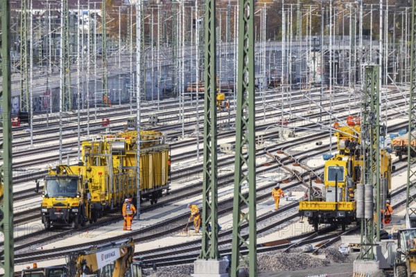 Rail construction crews with a work train. New parking station in Untertürkheim. As part of Stuttgart 21, train traffic is being reorganized. Among other things, 33 sidings are being built. Critical rail infrastructure with railroad tracks and overhead lines. Symbolic photo. Stuttgart, Baden-Württemberg, Germany