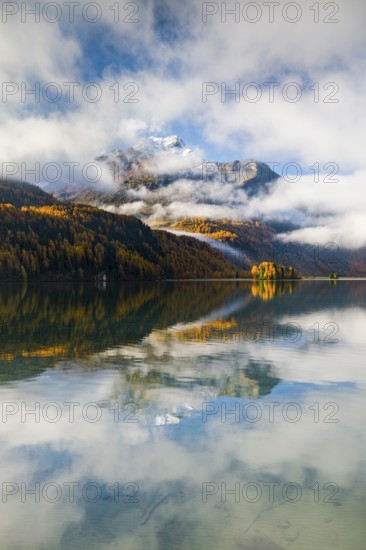 Clouds of fog over Lake Sils with Piz da la Margna in the background, Upper Engadin, Canton of Graubünden, Switzerland