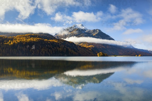 Clouds of fog over Lake Sils with Piz da la Margna in the background, Upper Engadin, Canton of Graubünden, Switzerland