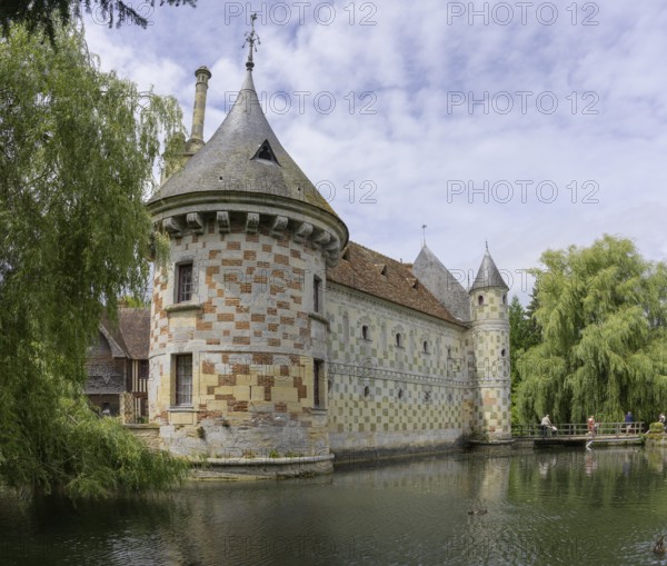 Castle surrounded by a moat in Saint-Germain-de-Livet, Calvados Department, France