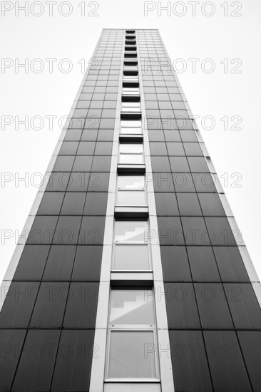 Modern architecture, geometric lines photographed in black and white, former water tower of the Radolfzell dairy plant, converted into the Hotel Aqua-Turm since 2017. The world's first zero-energy passive high-rise building, the entire façade consists of around 1000 photovoltaic modules and uses solar thermal wind power and hydrothermal energy to produce more energy than it consumes, Konstanz district, Baden-Württemberg, Germany