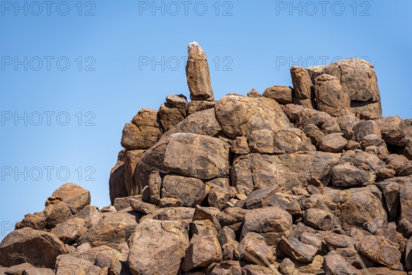 Round spherical rocks stacked into hills, Brandberg, Damaraland, Erongo, Namibia
