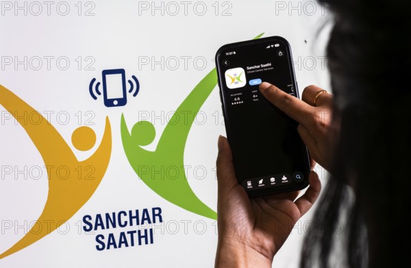 In this photo illustration, a person downloads the Sanchar Saathi mobile application on an iPhone, in New Delhi, India on 3 December 2025. Sanchar Saathi is officially developed and operated by the Department of Telecommunications (DoT), Government of India as part of its citizen-protection and telecom-security initiative