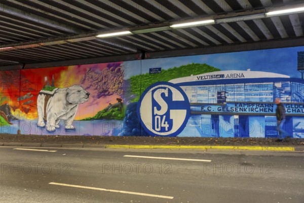 Huge street art pictures in a road tunnel in Gelsenkirchen, the approximately 120 meter long railway underpass of Wickingstraße was extensively painted and sprayed on both sides by 11 Gelsenkirchen graffiti artists and collectives, over a total length of 174 meters, the wall paintings showed motifs from Gelsenkirchen history, from economy, coal, steel, soccer, Schalke 04, culture, life, to the 150.year-old city Anniversary on 29.11.25, North Rhine-Westphalia, Germany