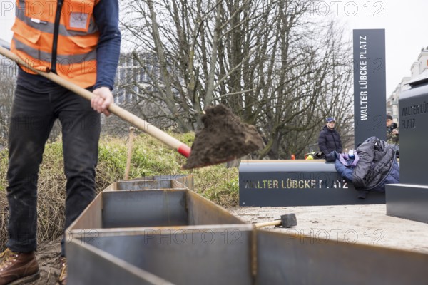 Workers erect the Walter Lübcke Square in front of the Konrad Adenauer Haus, the party headquarters of the Christian Democratic Union (CDU) on 2 December 2025. The square was erected by the Centre for Political Beauty (ZPS) and approved by the Berlin Mitte district authority for two years. Walter Lübcke was a member of the Hessian state parliament for the CDU and was murdered by an AfD supporter on 2 June 2019