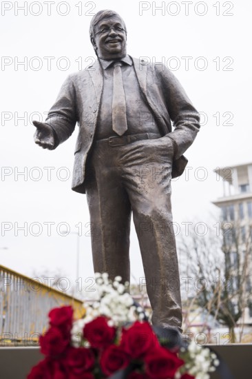 Walter Lübcke memorial with red roses and a mourning ribbon at the erection of Walter Lübcke Platz in front of the Konrad Adenauer Haus, the party headquarters of the Christian Democratic Union (CDU) on 2 December 2025. The square was erected by the Centre for Political Beauty (ZPS) and approved by the Berlin Mitte district authority for two years. Walter Lübcke was a member of the Hessian state parliament for the CDU and was murdered by an AfD supporter on 2 June 2019