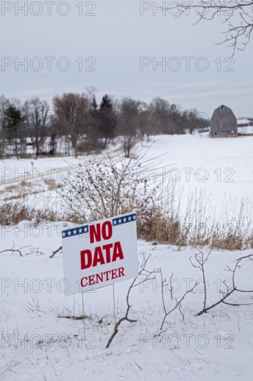 Saline, Michigan USA - 1 December 2025 - A sign on a rural Michigan road opposes a planned $7 billion data center on southeast Michigan farm land. Opponents say the Data Center could raise residential electricity rates and endanger the water supply